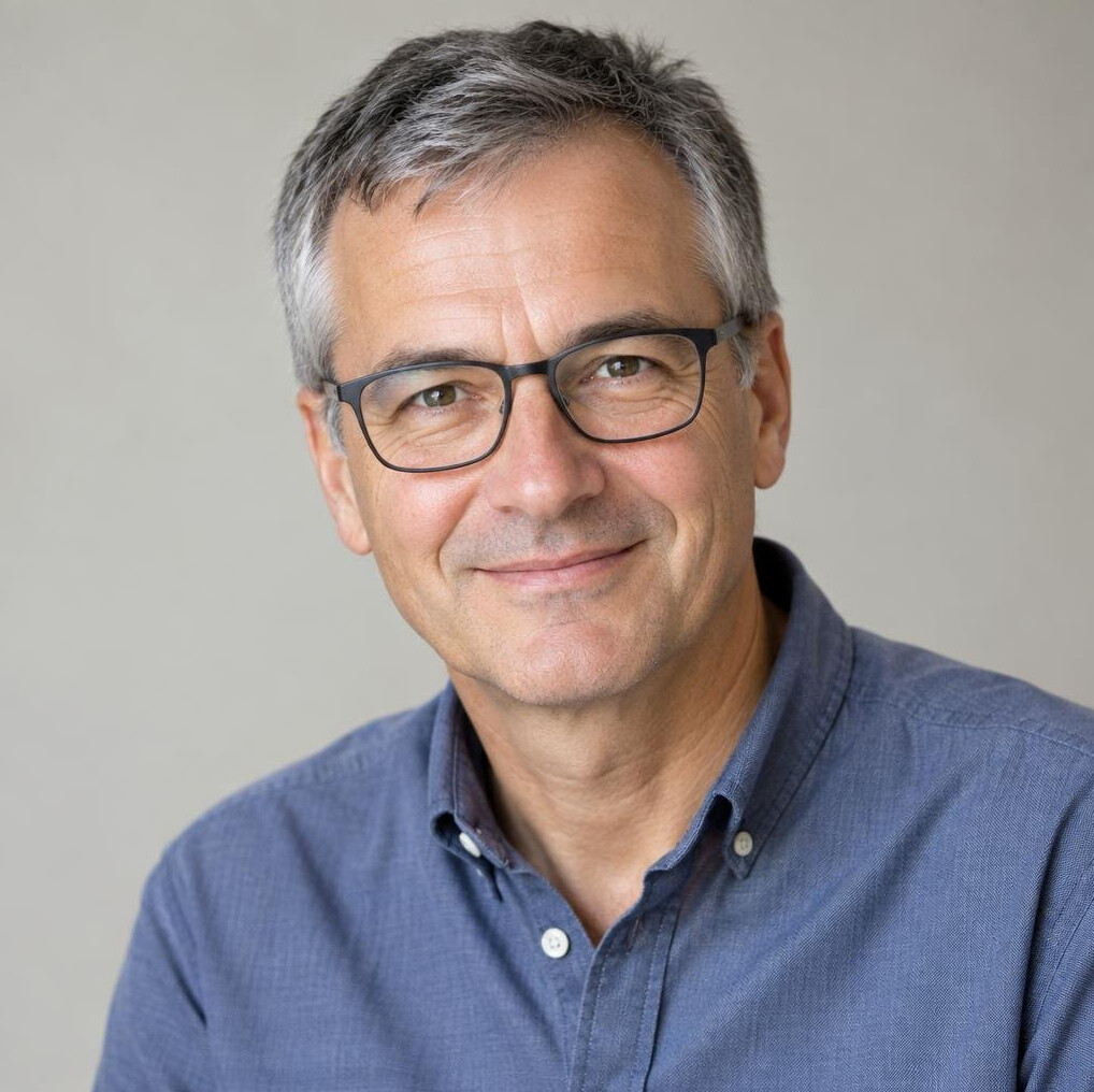 Studio portrait of a Swiss man in his fifties, television historian