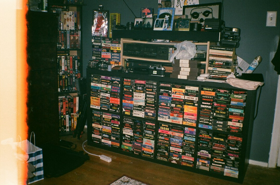 Television archive room with shelves of videotapes and film reels